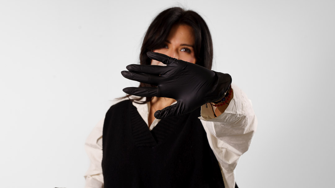 Esthetician in black gloves preparing for a first facial appointment at SkinArt Aesthetics in Huntingdon Valley PA